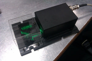 Wide beam eye safe laser module for laser labyrinth